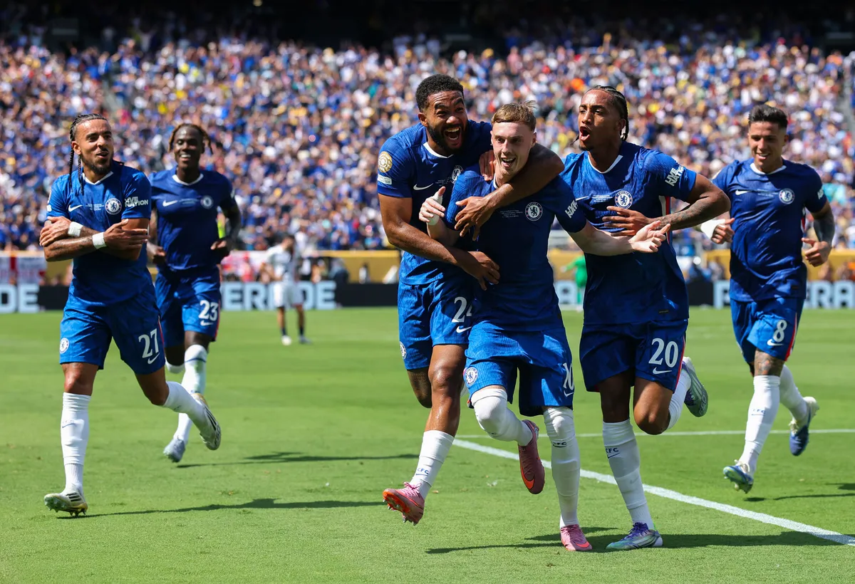 EAST RUTHERFORD, NEW JERSEY - JULY 13: Cole Palmer #10 of Chelsea FC celebrates scoring his team's second goal with Joao Pedro #20 and Reece James #24 of Chelsea FC during the FIFA Club World Cup 2025 Final match between Chelsea FC and Paris Saint-Germain at MetLife Stadium on July 13, 2025 in East Rutherford, New Jersey.   Alex Grimm/Getty Images/AFP (Photo by ALEX GRIMM / GETTY IMAGES NORTH AMERICA / Getty Images via AFP)