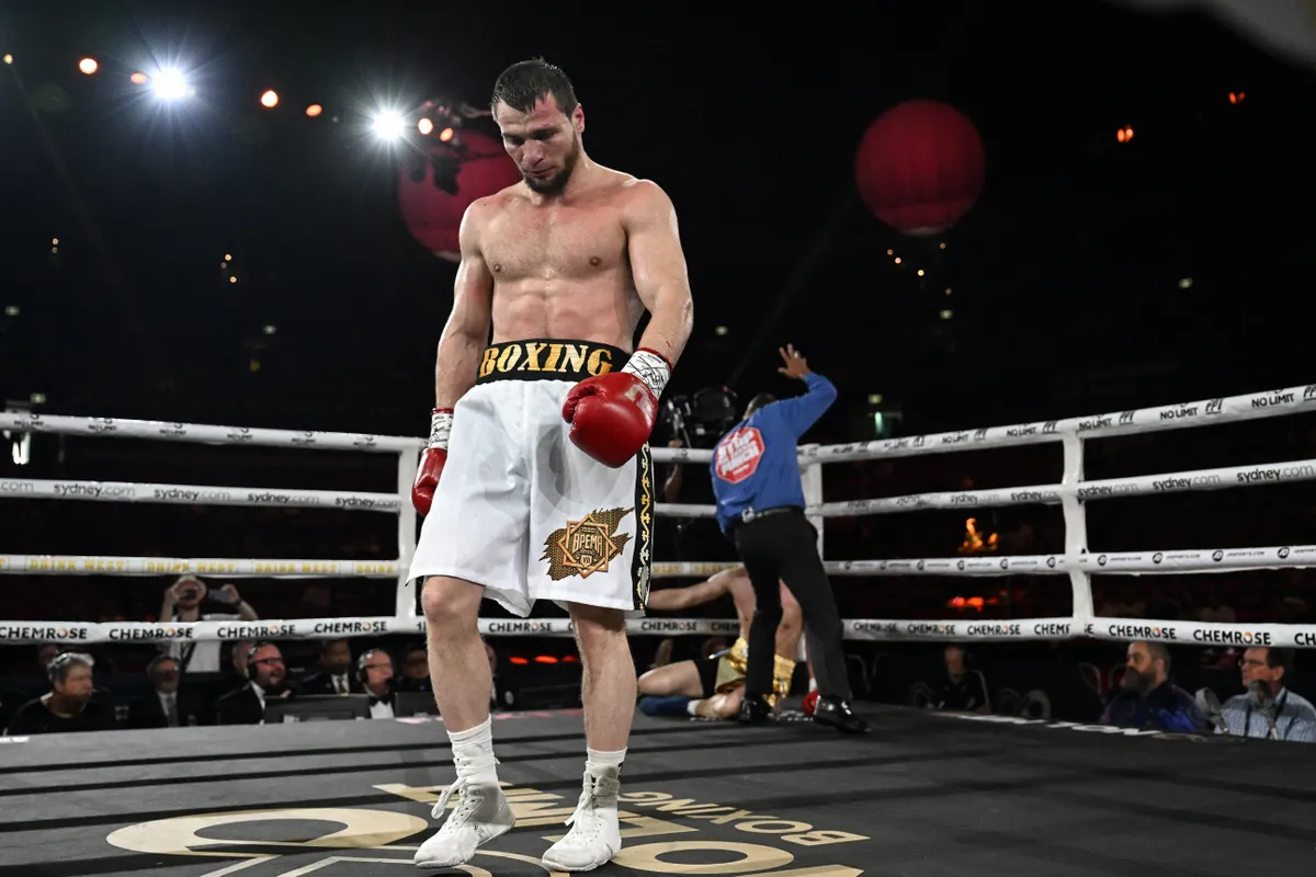 dopping, Russian boxer Imam Khataev (L) reacts after South Korea's Gi Sung Gwak fell to the canvas following a hit during the light heavyweight bout, taking place ahead of the WBO super-welterweight world title fight between Australia's Tim Tszyu and Tony Harrison of the US at Qudos Bank Arena in Sydney on March 12, 2023. (Photo by Saeed KHAN / AFP) / -- IMAGE RESTRICTED TO EDITORIAL USE - STRICTLY NO COMMERCIAL USE --