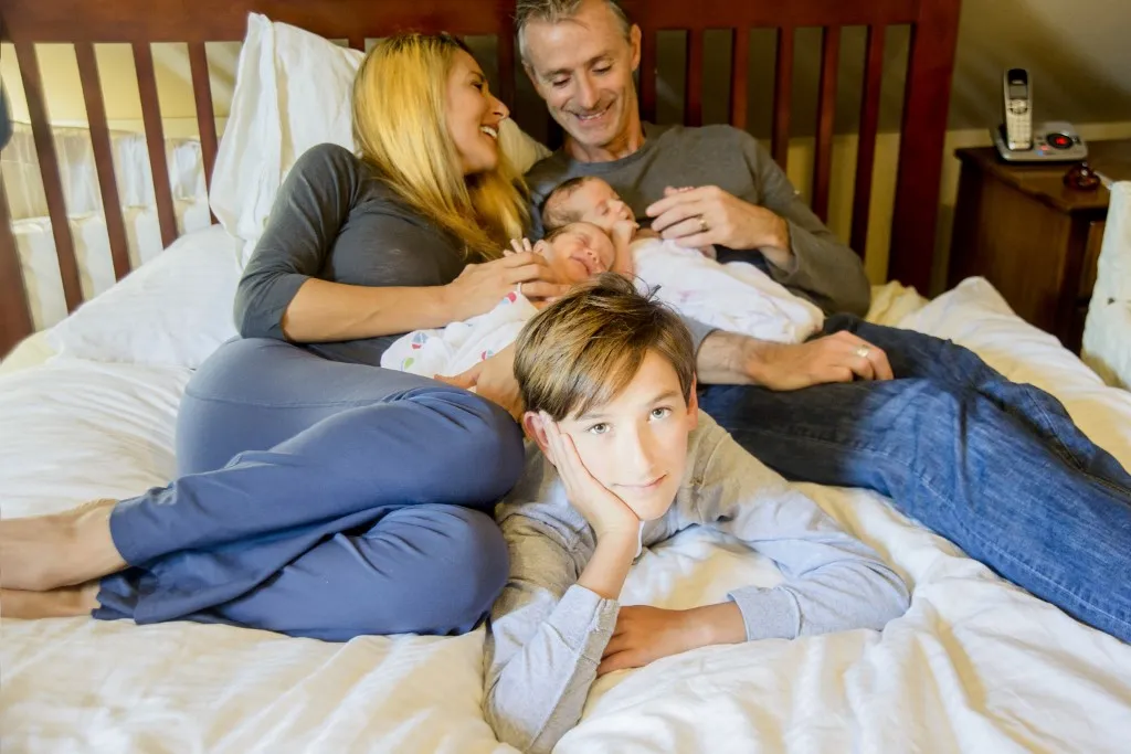 Couple with son and newborn twin girl and boy (Photo by Sue Barr / Connect Images via AFP)