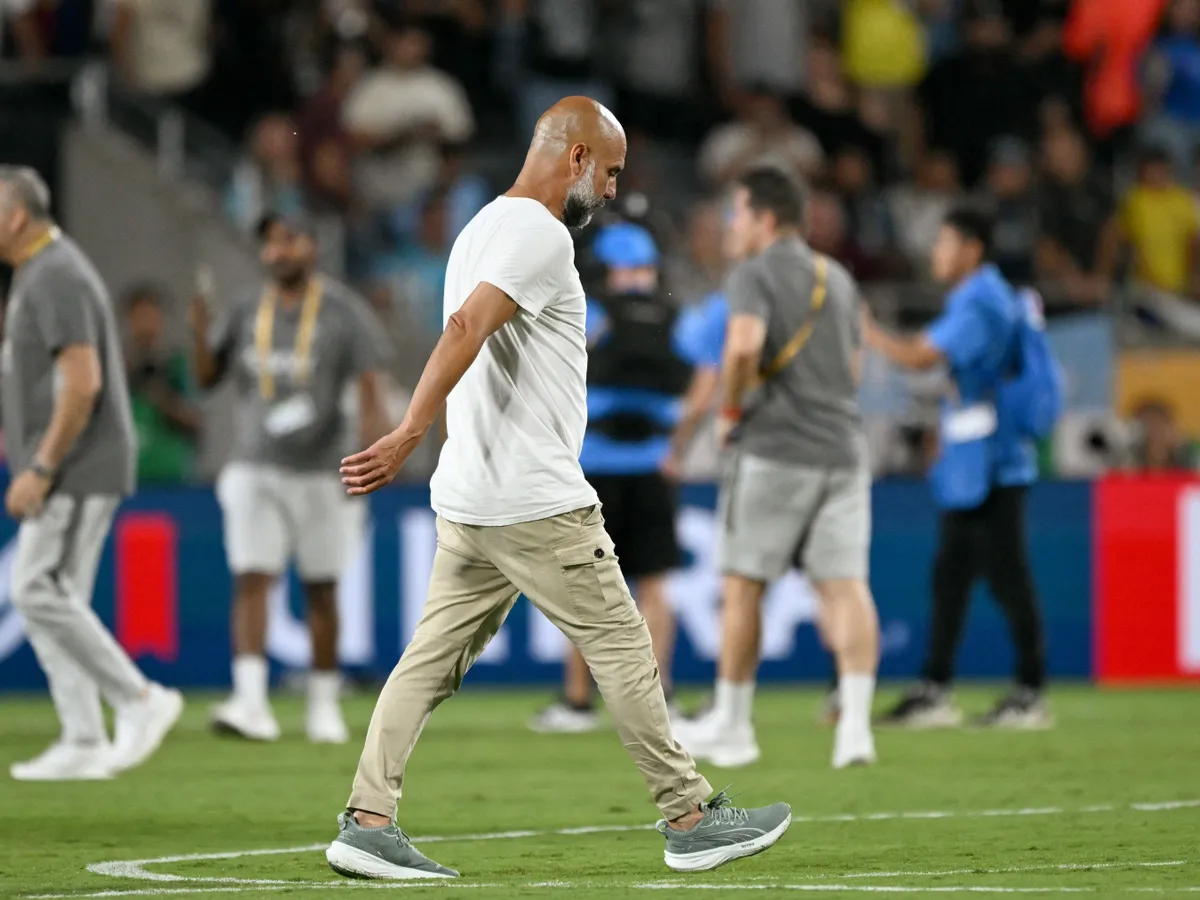 Pep Guardiola, Manchester City's Spanish head coach Pep Guardiola walks on the pitch after losing the FIFA Club World Cup 2025 round of 16 football match between England's Manchester City and Saudi's Al-Hilal at the Camping World stadium in Orlando on June 30, 2025. (Photo by CHANDAN KHANNA / AFP)