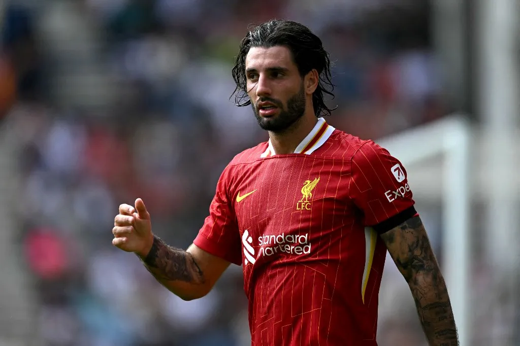 Liverpool's Hungarian midfielder #08 Dominik Szoboszlai gestures during the pre-season friendly football match between Preston North End and Liverpool at Deepdale stadium in Preston, north-west England on July 13, 2025. Liverpool are to retire Diogo Jota's number 20 shirt in honour of the Portugal forward who was killed in a car crash this month. The club return to action for the first time since the July 3 tragedy at English Championship side Preston today. (Photo by Oli SCARFF / AFP) / RESTRICTED TO EDITORIAL USE. No use with unauthorized audio, video, data, fixture lists, club/league logos or 'live' services. Online in-match use limited to 120 images. An additional 40 images may be used in extra time. No video emulation. Social media in-match use limited to 120 images. An additional 40 images may be used in extra time. No use in betting publications, games or single club/league/player publications. / 