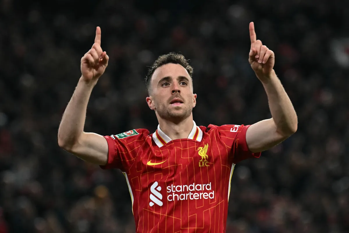 (FILES) Liverpool's Portuguese striker #20 Diogo Jota celebrates after scoring a goal during the English League Cup third round football match between Liverpool and West Ham United at Anfield in Liverpool, north west England on September 25, 2024. Liverpool striker Diogo Jota died along with his brother early July 3, 2025 in a road accident in northwest Spain, the Spanish Civil Guard said. The accident occurred around 12:30 a.m. on a highway in the province of Zamora. The vehicle "left the road" before bursting into flames, the Civil Guard said, adding that the two passengers, Diogo Jota and his brother Andre Felipe, also a professional footballer, were deceased. (Photo by Paul ELLIS / AFP) / RESTRICTED TO EDITORIAL USE. No use with unauthorized audio, video, data, fixture lists, club/league logos or 'live' services. Online in-match use limited to 120 images. An additional 40 images may be used in extra time. No video emulation. Social media in-match use limited to 120 images. An additional 40 images may be used in extra time. No use in betting publications, games or single club/league/player publications. / 