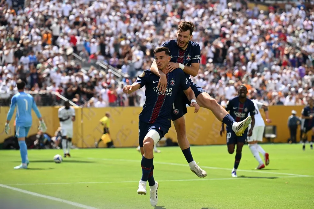 Paris Saint-Germain's Spanish midfielder #08 Fabian Ruiz (L) celebrates scoring his team's first goal during the FIFA Club World Cup 2025 semifinal football match between France's Paris Saint-Germain and Spain's Real Madrid at the MetLife stadium in East Rutherford, New Jersey on July 9, 2025. (Photo by ANGELA WEISS / AFP)
