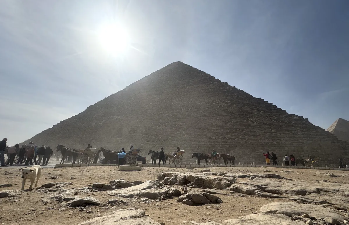 CAIRO, EGYPT - FEBRUARY 25: A view of Great Pyramid of Giza, one of the seven wonders of the world, in Cairo, Egypt on February 25, 2025. The pyramids of Khufu, Khafre, and Menkaure, built 4,500 years ago as tombs for the pharaohs, remain a fascinating site for historians and scientists. Among them, only the Great Pyramid of Khufu has endured, continuing to draw interest from tourists worldwide. Yunus Hocaoglu / Anadolu (Photo by Yunus Hocaoglu / Anadolu via AFP)