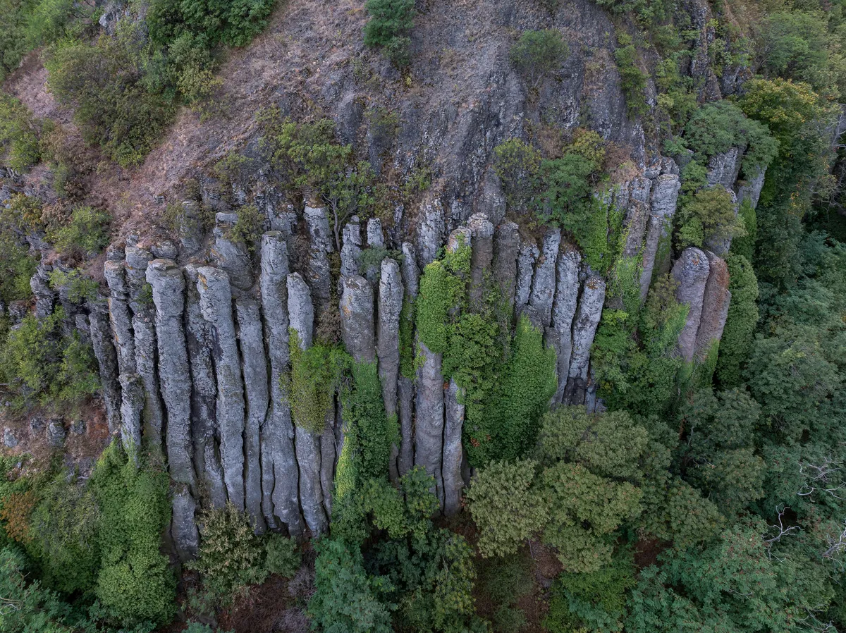 Kisapati, Hungary - Aerial view of volcanic basalt organs at Szent Gyorgy-hegy near lake Balaton with moody tones.