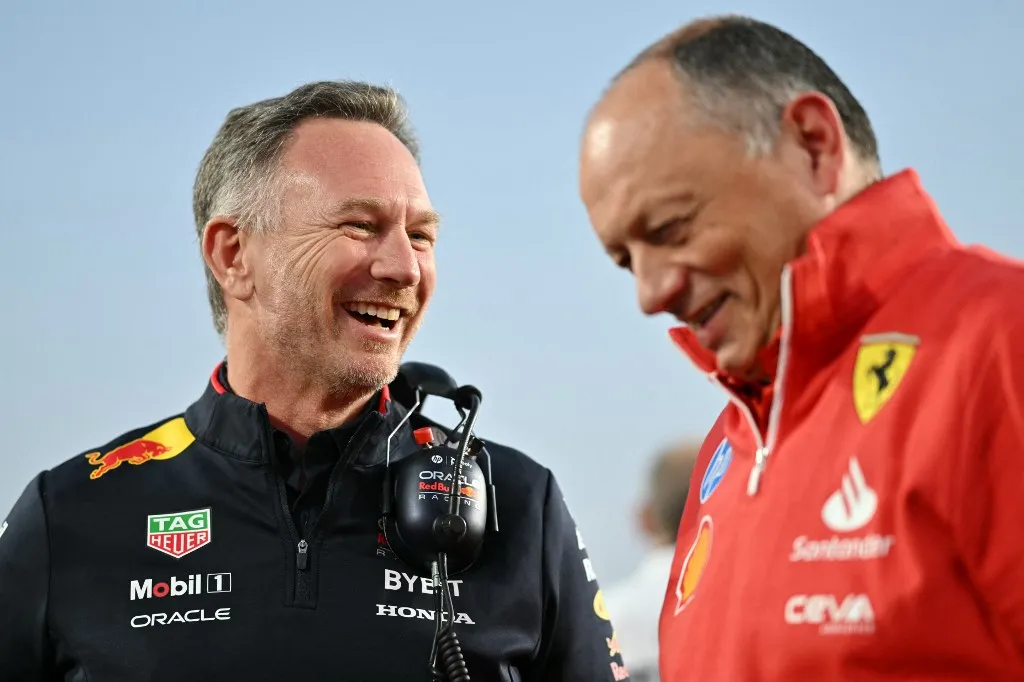 Red Bull Racing's British team principal and CEO Christian Horner (L) and Ferrari's French team principal Frédéric Vasseur talk at the grid before the sprint race ahead of the Qatari Formula One Grand Prix at the Lusail International Circuit in Lusail, north of Doha, on November 30, 2024. (Photo by Andrej ISAKOVIC / AFP)