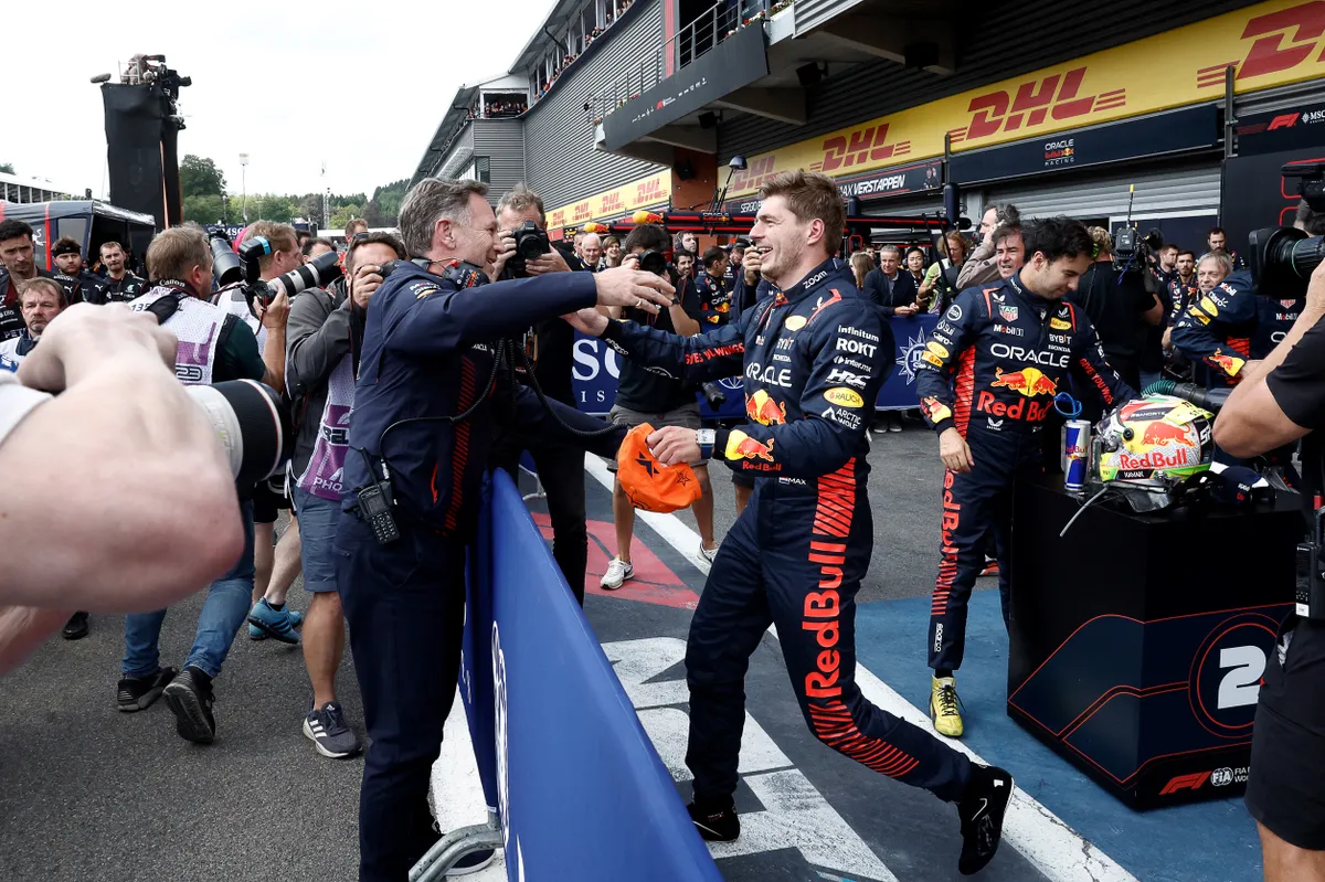 (FILES) Red Bull Racing's Dutch driver Max Verstappen (R) reacts with Red Bull Racing's British team principal Christian Horner in the parc ferme after winning the Formula One Belgian Grand Prix at the Spa-Francorchamps Circuit in Spa on July 30, 2023. Christian Horner is to leave his role as Red Bull team principal with immediate effect after 20 years, the Formula One team announced on July 9, 2025. (Photo by SIMON WOHLFAHRT / AFP)