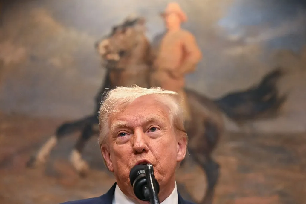 US President Donald Trump speaks before signing the VA Home Loan Program Reform Act in the Roosevelt Room of the White House in Washington, DC, on July 30, 2025. The bill aims to help veterans receive improved federal assistance for home mortgages. (Photo by Jim WATSON / AFP)