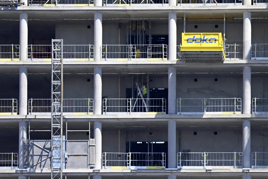 A building under construction is pictured on July 2, 2025 in Berlin. (Photo by John MACDOUGALL / AFP)