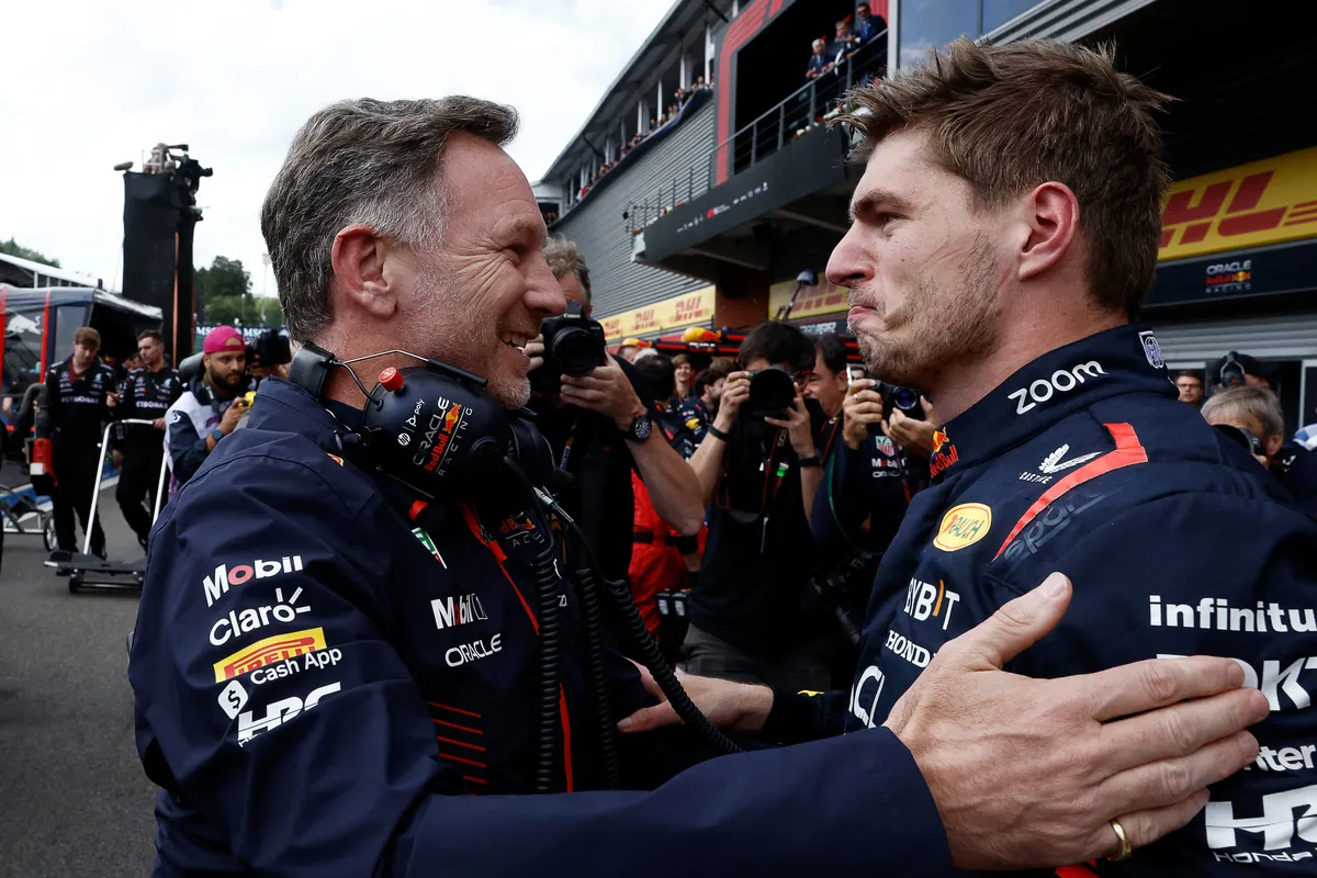 (FILES) Red Bull Racing's Dutch driver Max Verstappen (R) reacts with Red Bull Racing's British team principal Christian Horner   in the parc ferme after winning the Formula One Belgian Grand Prix at the Spa-Francorchamps Circuit in Spa on July 30, 2023. Christian Horner is to leave his role as Red Bull team principal with immediate effect after 20 years, the Formula One team announced on July 9, 2025. (Photo by SIMON WOHLFAHRT / AFP)