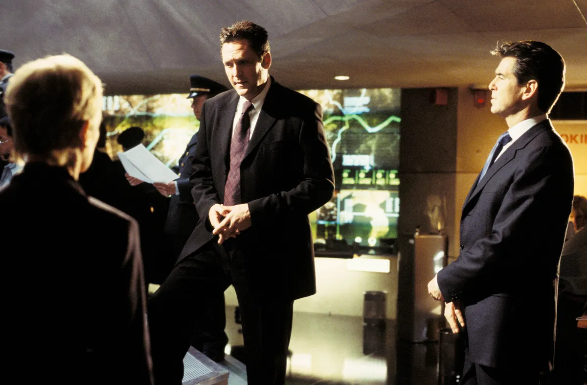 2002; James Bond: Die Another Day 07. Original Film Title: James Bond: Die Another Day 07, PICTURED: MICHAEL MADSEN, PIERCE BROSNAN, Director: Lee Tamahori, IN CAST: Pierce Brosnan, Halle Berry, Toby Stephens, Rick Yune, Judi Dench, John Cleese, Michael Madsen, Rosamund Pike, Madonna 