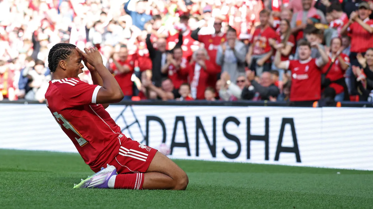 Liverpool's English striker #73 Rio Ngumoha celebrates scoring the opening goal during the first of two pre season friendly football matches between Liverpool and Athletic Bilbao at Anfield in Liverpool, north west England on August 4, 2025. (Photo by Darren Staples / AFP)