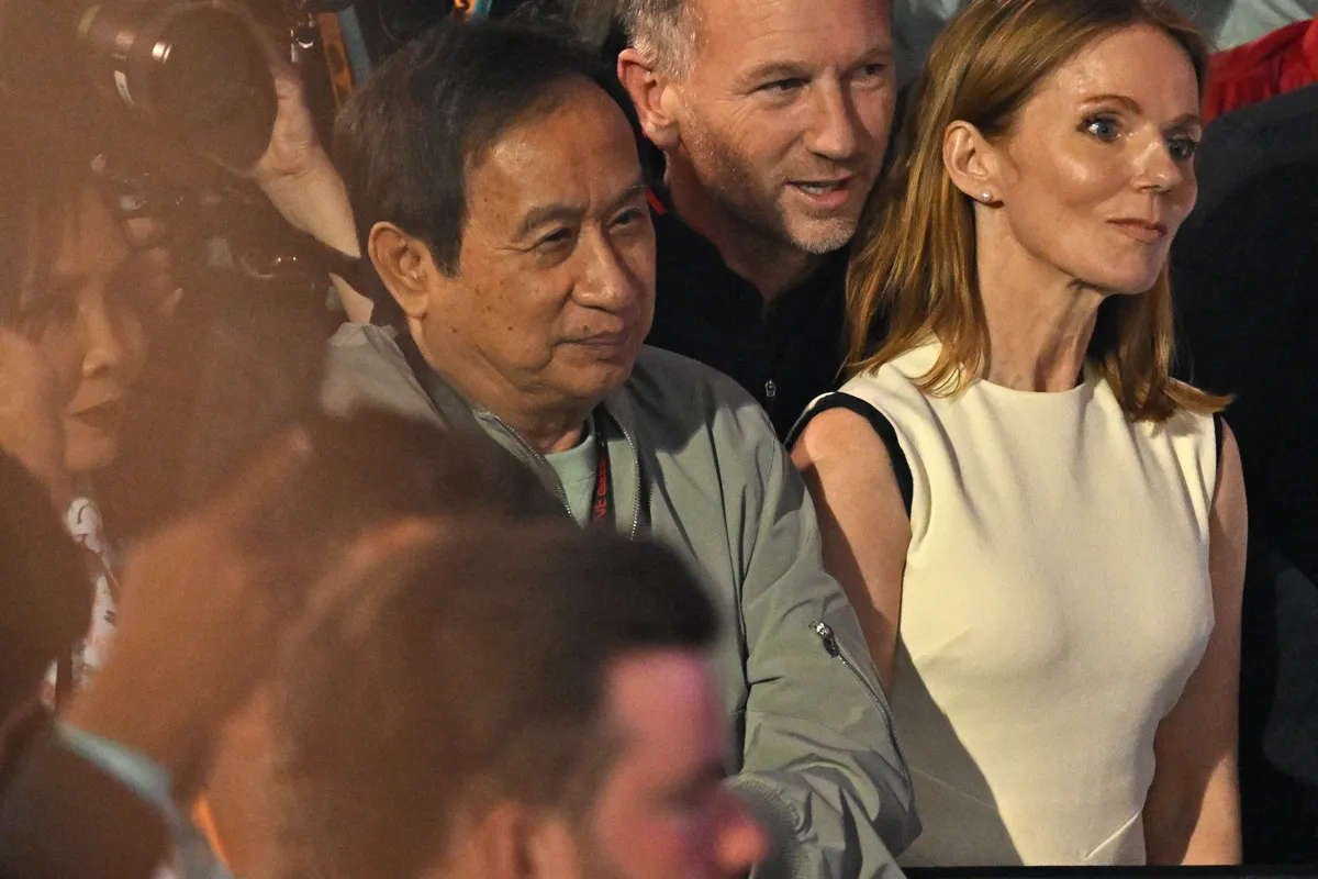 Red Bull Racing team principal Christian Horner (2R) along with his wife British singer Geri Halliwell (R) and Thai businessman Chalerm Yoovidhya (C) and his wife Daranee Yoovidhya (L) attend the podium ceremony of the Bahrain Formula One Grand Prix at the Bahrain International Circuit in Sakhir on March 2, 2024. (Photo by ANDREJ ISAKOVIC / AFP)