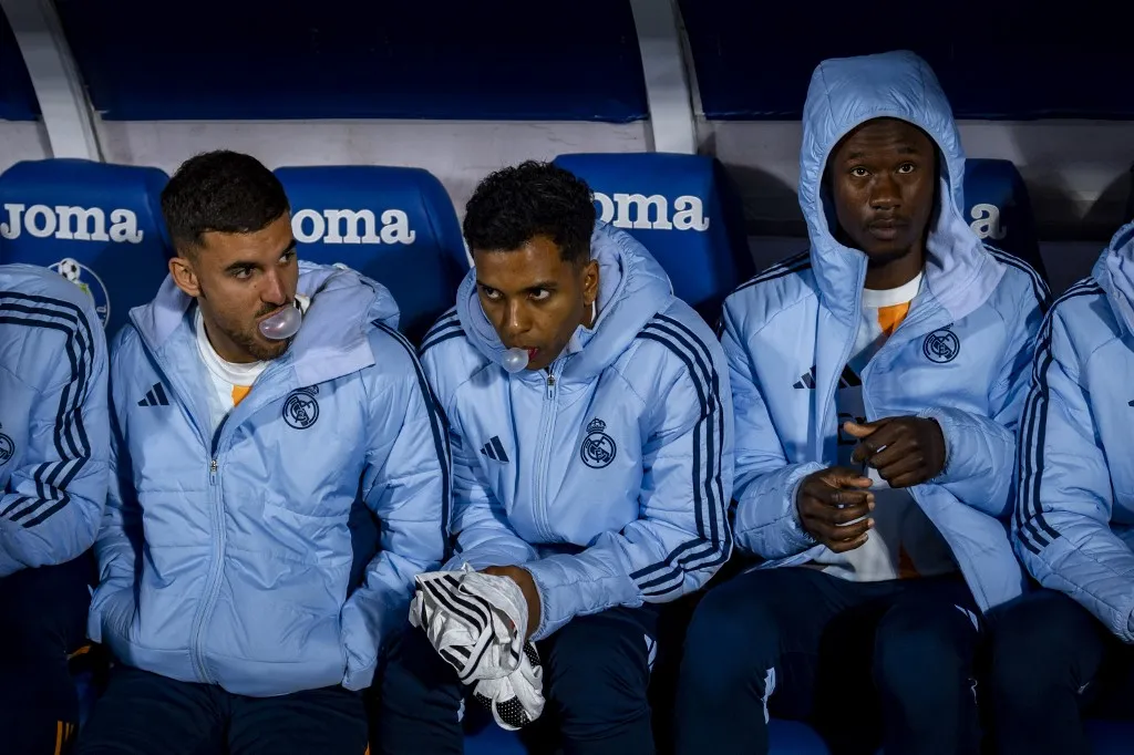 Players of Real Madrid CF (from L to R) Dani Ceballos, Rodrygo Silva de Goes, and Eduardo Camavinga sit on the bench during the La Liga EA Sports 2024/25 football match between Getafe CF and Real Madrid CF at Estadio Coliseum in Getafe, Spain, on April 23, 2025. (Photo by Alberto Gardin/NurPhoto) (Photo by Alberto Gardin / NurPhoto via AFP)