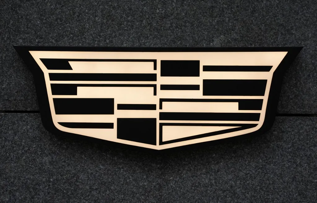 28 November 2024, Hamburg: The company logo of the US car manufacturer Cadillac can be seen in front of the Cadillac showroom in Hamburg city center. Photo: Marcus Brandt/dpa (Photo by MARCUS BRANDT / dpa Picture-Alliance via AFP)