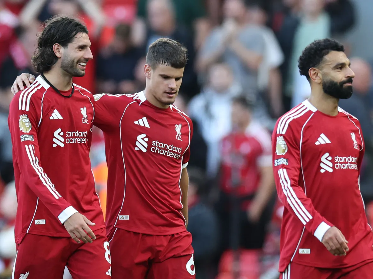 Szoboszlai, Liverpool's Hungarian midfielder #08 Dominik Szoboszlai (L) walks off with Liverpool's Hungarian defender #06 Milos Kerkez (C) and Liverpool's Egyptian striker #11 Mohamed Salah (R) at the end of the English Premier League football match between Liverpool and Arsenal at Anfield in Liverpool, north west England on August 31, 2025. (Photo by Darren Staples / AFP) / RESTRICTED TO EDITORIAL USE. No use with unauthorized audio, video, data, fixture lists, club/league logos or 'live' services. Online in-match use limited to 120 images. An additional 40 images may be used in extra time. No video emulation. Social media in-match use limited to 120 images. An additional 40 images may be used in extra time. No use in betting publications, games or single club/league/player publications. /