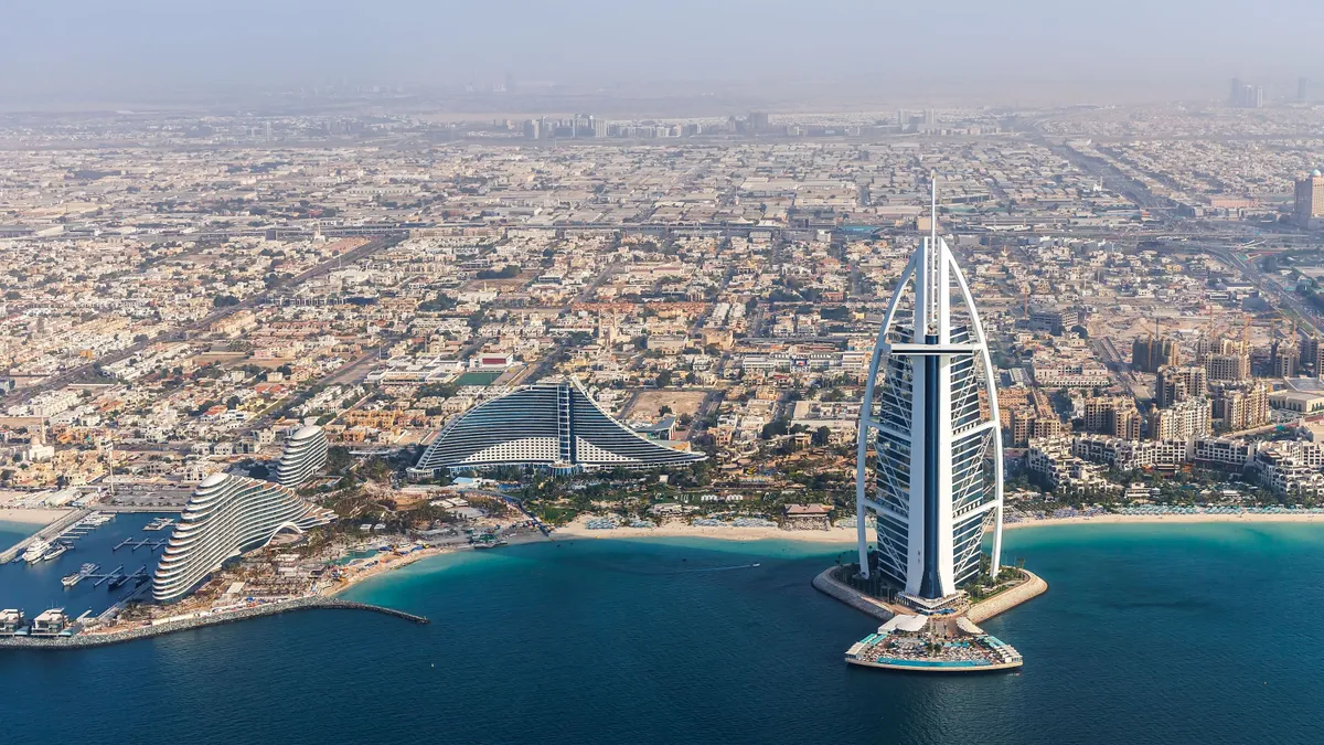 Dubai Burj Al Arab luxury hotel at sea aerial view photography from above in United Arab Emirates, Ciel Hotel