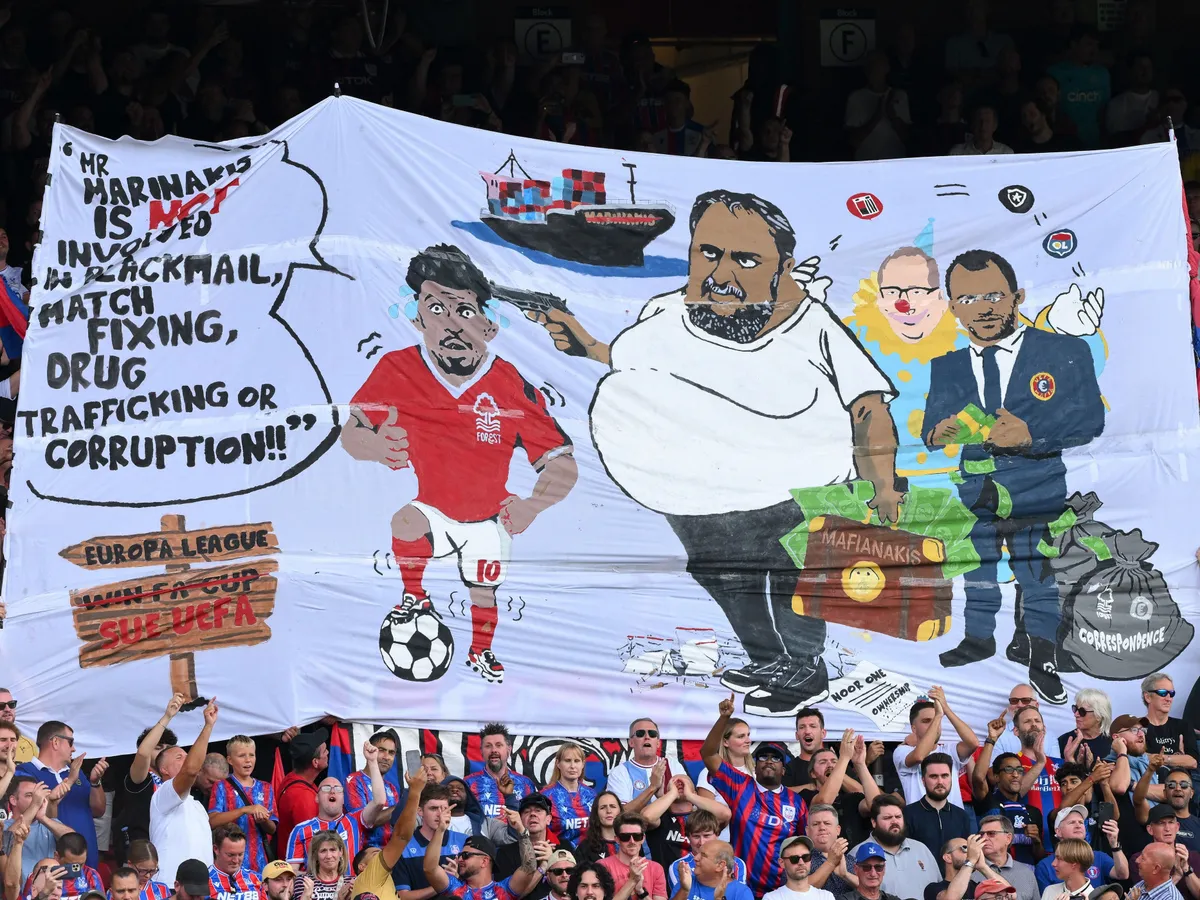 Marinakisz, A banner by Crystal Palace fans about the Nottingham Forest owner is displayed during the Premier League match between Crystal Palace and Nottingham Forest at Selhurst Park in London, England, on August 24, 2025. (Photo by Jon Hobley/MI News/NurPhoto) (Photo by MI News / NurPhoto via AFP)