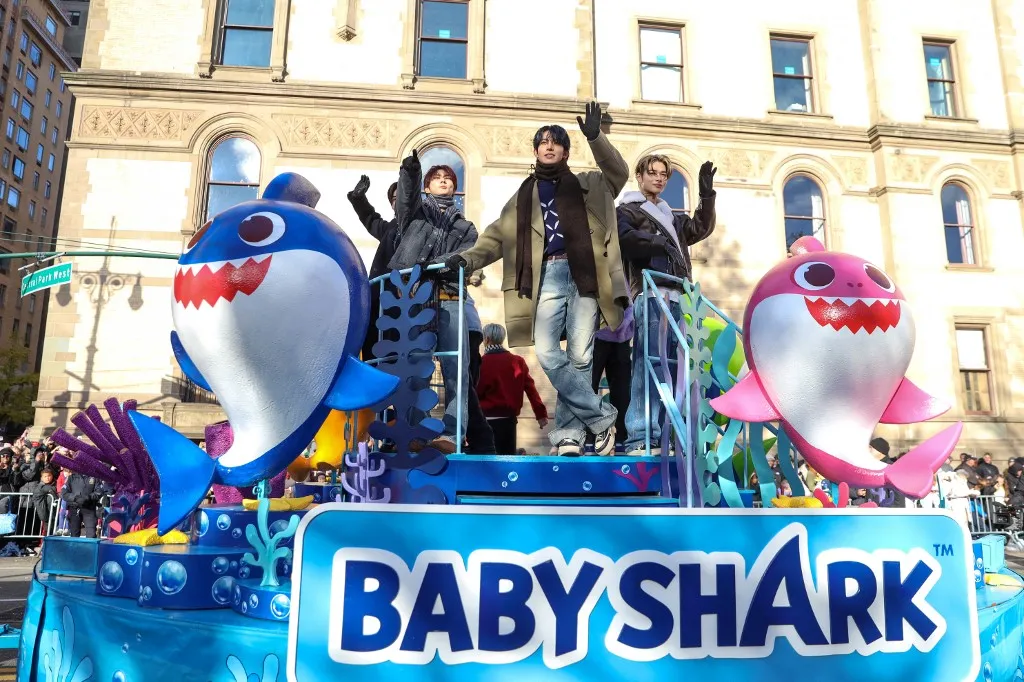 Enhypen band members ride the Baby Shark float at the 2023 Macy's Thanksgiving Day Parade on November 23, 2023 in New York City. (Photo by William Volcov / Brazil Photo Press via AFP)