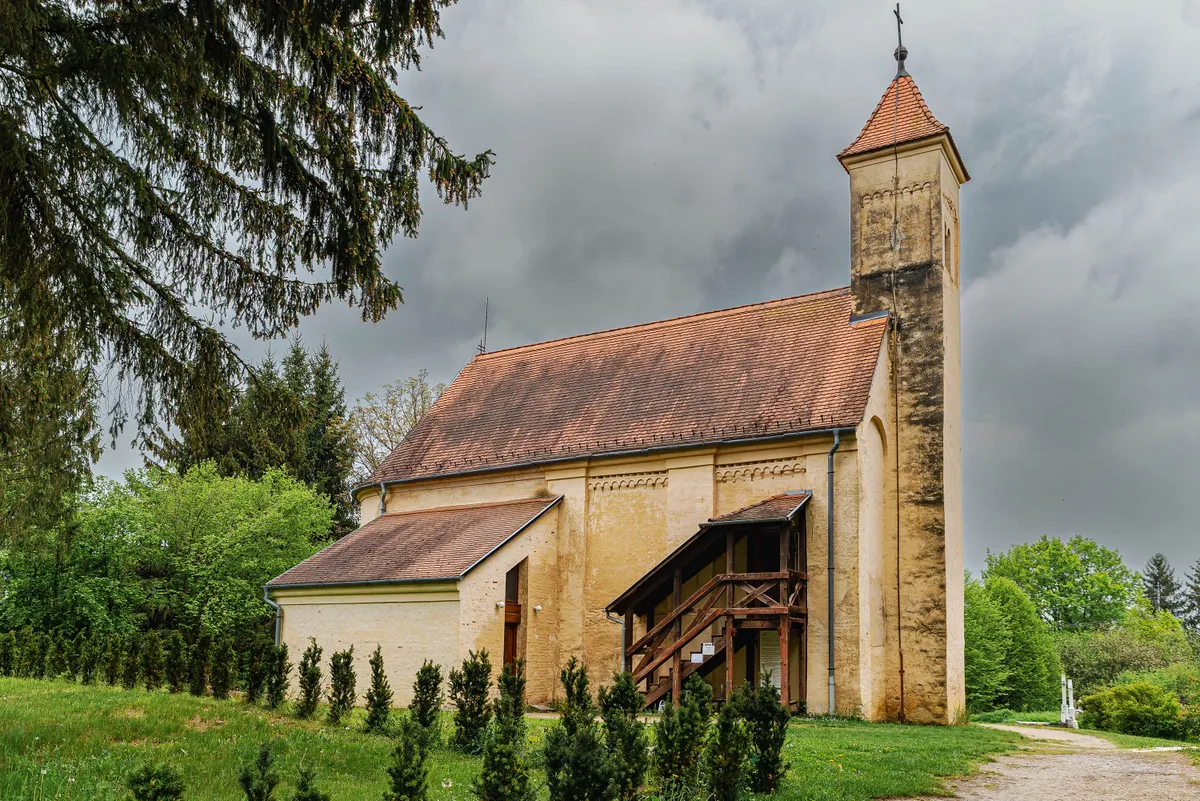 Sait Peter Apostole ancient church in Oriszentpeter village. This is the part of the Orseg national Park in Hungary. 
Medieval temple from Arpad era.