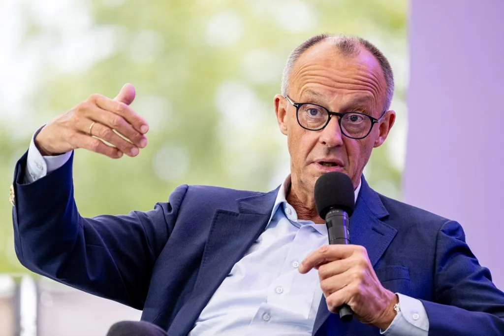 24 August 2025, Berlin: Federal Chancellor Friedrich Merz (CDU) takes part in an on-stage talk at the Federal Chancellery on the Open Day of the new Federal Government. During the weekend, there will be an opportunity to take a look behind the scenes of politics and find out about the work of the Federal Government. Photo: Fabian Sommer/dpa (Photo by Fabian Sommer / dpa Picture-Alliance via AFP)