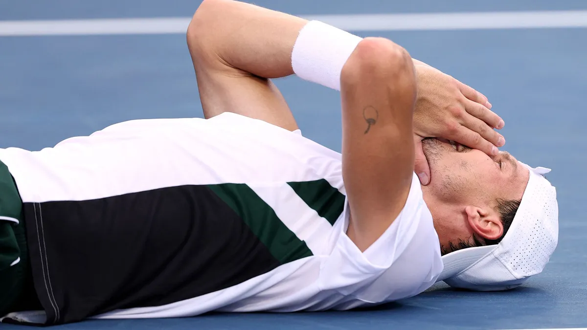 Fucsovics Márton, WINSTON SALEM, NORTH CAROLINA - AUGUST 23: Márton Fucsovics of Hungary reacts after his win against Botic van de Zandschulp of Netherlands in the mens finals of the ATP 250 Winston-Salem Open at Wake Forest Tennis Complex on August 23, 2025 in Winston-Salem, North Carolina.   Grant Halverson/Getty Images/AFP (Photo by GRANT HALVERSON / GETTY IMAGES NORTH AMERICA / Getty Images via AFP)