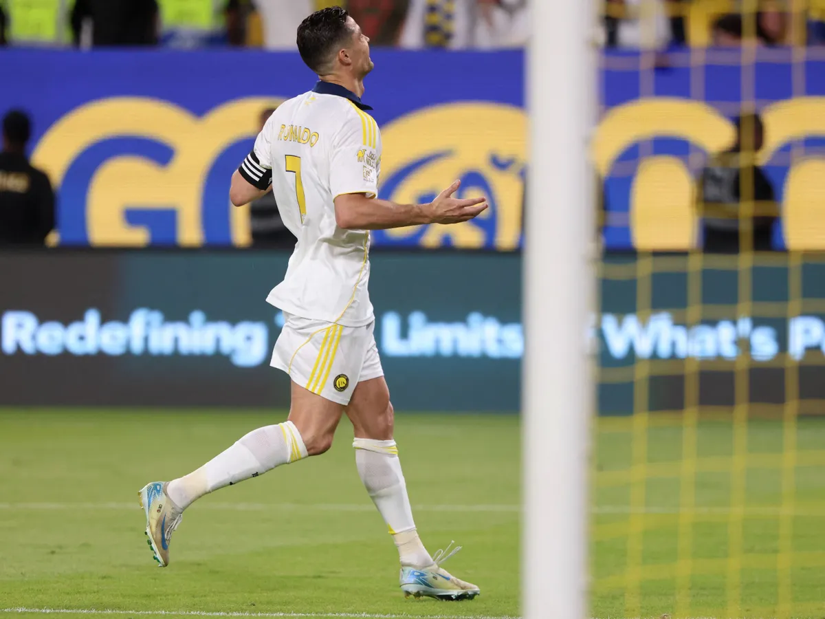 Nassr's Portuguese forward #7 Cristiano Ronaldo celebrates after scoring his team's second goal from the penalty spot during the Saudi Pro League football match between Al-Nassr and Al-Khaleej at Al-Awwal Park in Riyadh on May 21, 2025. (Photo by Fayez NURELDINE / AFP)