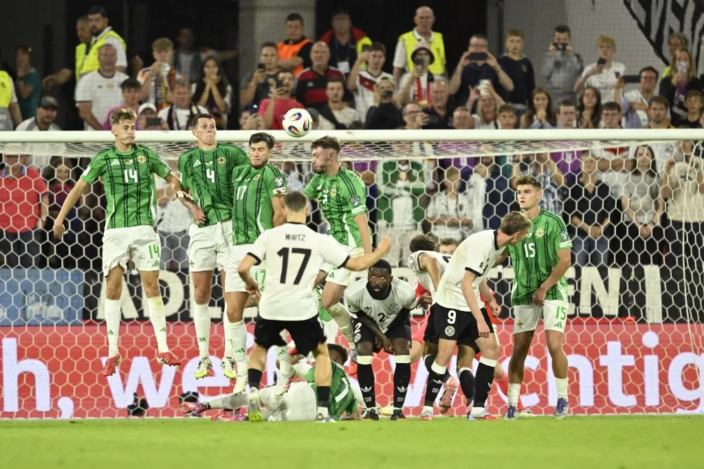Germany's midfielder #17 Florian Wirtz (C) scores the 3-1 goal during the 2026 World Cup qualifiers Europe zone group A football match between Germany and Northern Ireland on September 7, 2025 in Cologne, western Germany. (Photo by INA FASSBENDER / AFP)