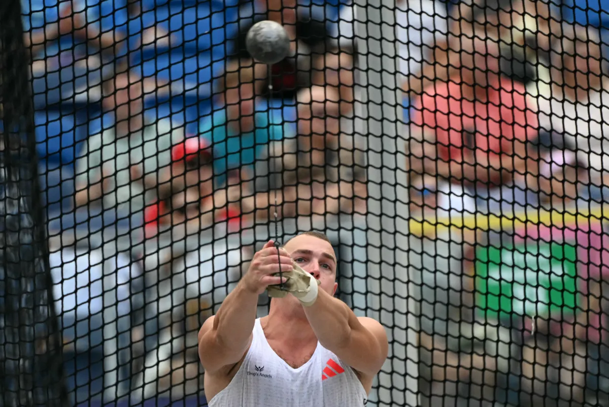 Hungary's Bence Halasz competes during the men's hammer throw event of the Silesia Diamond League athletics meeting in the Stadion Slaski in Chorzow, Poland, on August 16, 2025. (Photo by Sergei GAPON / AFP)