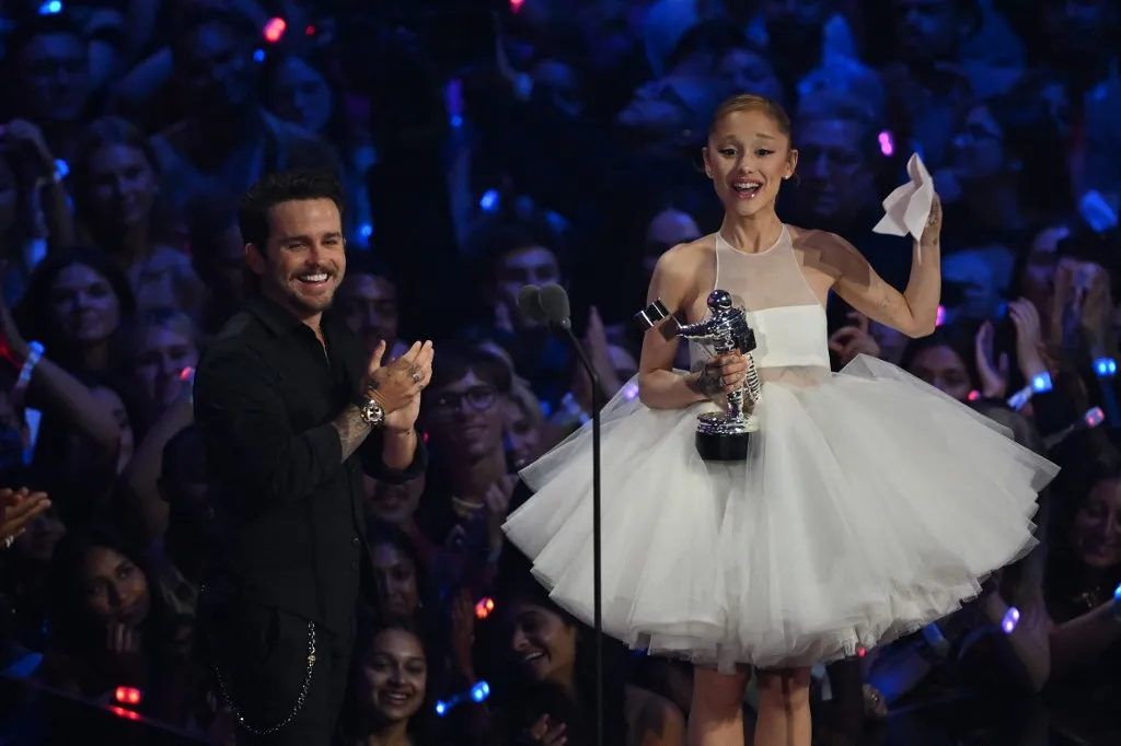 US singer-songwriter Ariana Grande (R) and US music video director Christian Breslauer accept the award for Video of the Year for "Brighter Days Ahead" on stage during the MTV Video Music Awards at UBS Arena in Elmont, New York, on September 7, 2025. (Photo by ANGELA WEISS / AFP)