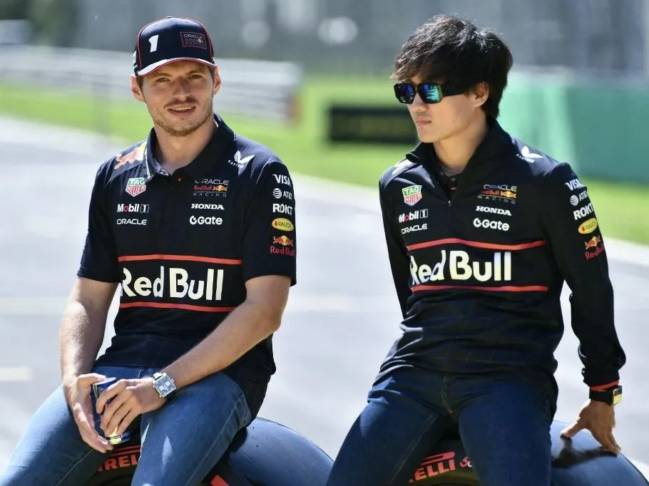 Red Bull Racing's Dutch driver Max Verstappen (L) and Red Bull Racing's Japanese driver Yuki Tsunoda (R) look on during the drivers' parade prior to the Italian Formula One Grand Prix at the Autodromo Nazionale Monza circuit, in Monza, northern Italy, on September 7, 2025. (Photo by Marco BERTORELLO / AFP)