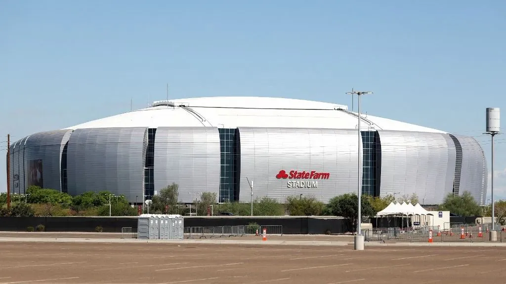 General view of the State Farm stadium ahead of the funeral of right-wing activist Charlie Kirk in Glendale, Arizona, on September 20, 2025. For Americans, the words are practically sacred: the First Amendment to the US Constitution guarantees freedom of speech. But that right is now the subject of bitter debate, following the assassination of right-wing activist Charlie Kirk. On September 18, several high-ranking Democrats accused President Donald Trump of waging war on free speech, after he celebrated ABC's suspension of talk show host Jimmy Kimmel, who accused the political right of using Kirk's death to score points. (Photo by CHARLY TRIBALLEAU / AFP)