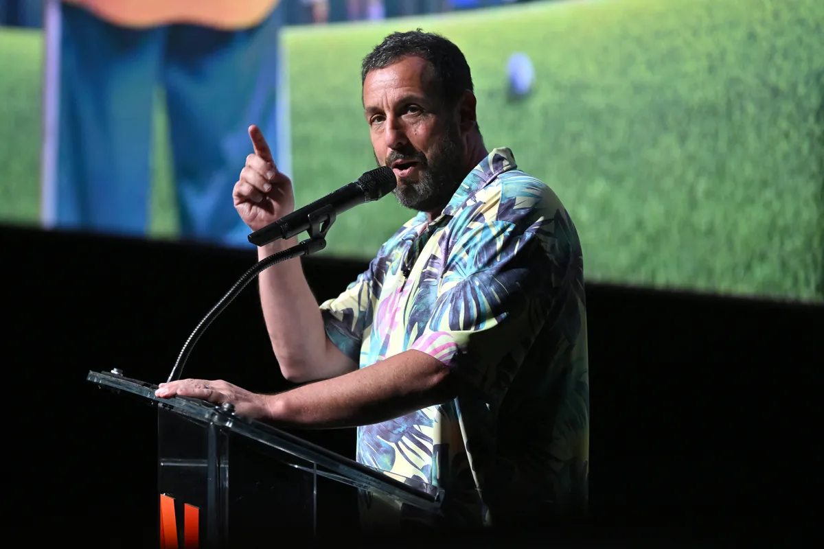 NEW YORK, NEW YORK - JULY 21: Adam Sandler speaks onstage during the Happy Gilmore 2 World Premiere at Jazz at Lincoln Center on July 21, 2025 in New York City.   Roy Rochlin/Getty Images for Netflix/AFP (Photo by Roy Rochlin / GETTY IMAGES NORTH AMERICA / Getty Images via AFP)