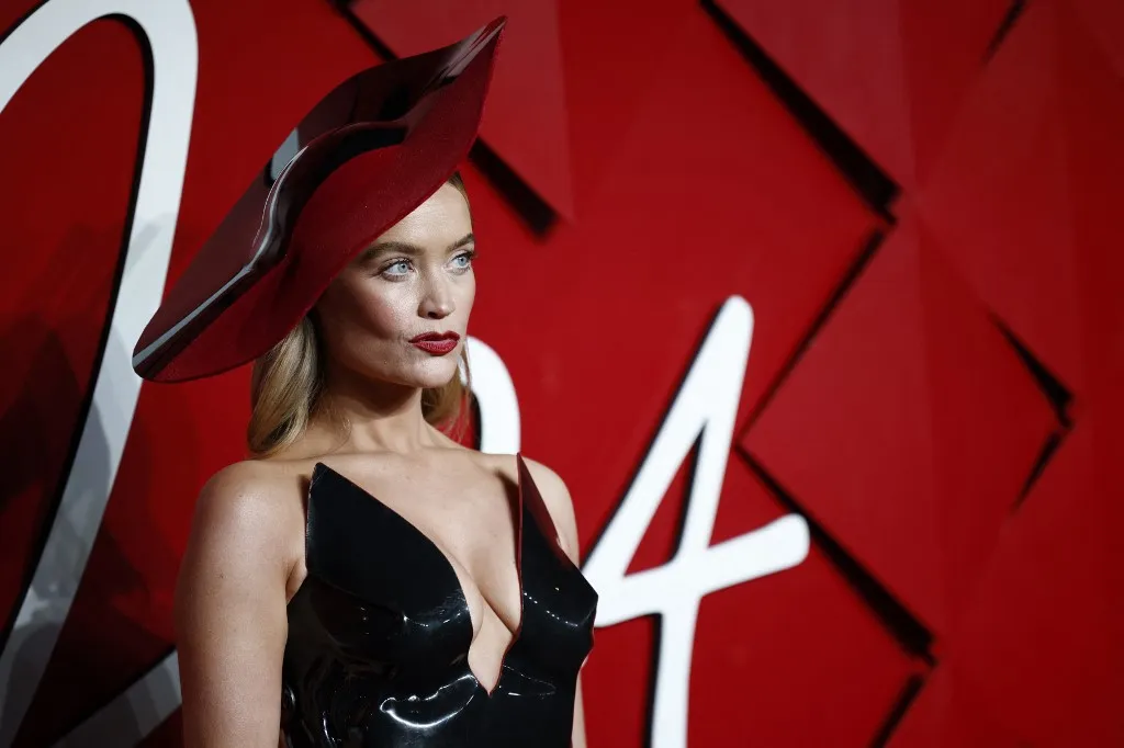 Irish model Laura Whitmore poses on the red carpet upon arrival at The 2024 Fashion Awards at the Royal Albert Hall in London on December 2, 2024. (Photo by BENJAMIN CREMEL / AFP) / RESTRICTED TO EDITORIAL USE -  NO MARKETING NO ADVERTISING CAMPAIGNS