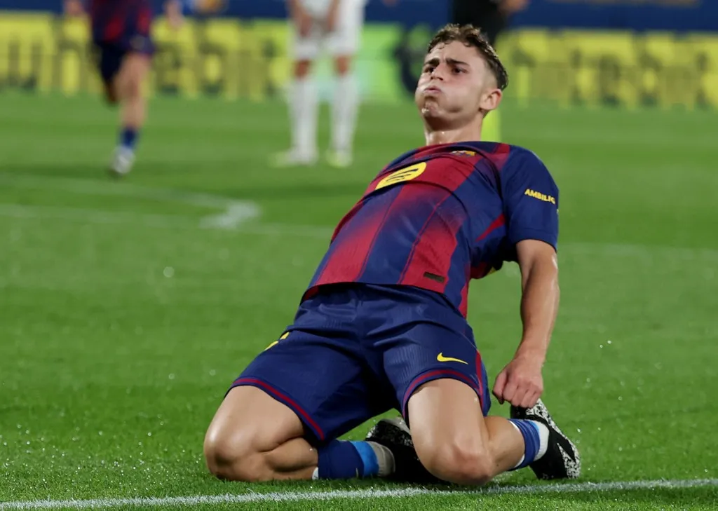 Barcelona's Spanish midfielder #16 Fermin Lopez celebrates scoring his team's third goal during the Spanish league football match between FC Barcelona and Valencia CF at Johan Cruyff Stadium in Barcelona, on September 14, 2025. (Photo by Lluis GENE / AFP)