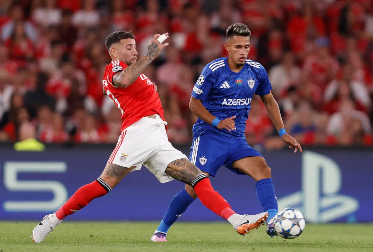 Benfica's Argentine defender #30 Nicolas Otamendi (L) and Garabagh's Colombian forward #17 Camilo Duran fight for the ball during the UEFA Champions League first round day 1 football match between SL Benfica and Garabagh at the Luz stadium in Lisbon on September 16, 2025. (Photo by FILIPE AMORIM / AFP)