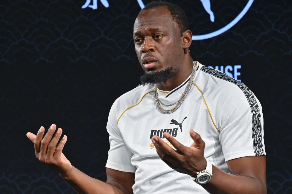 Legendary sprinter Jamaicas Usain Bolt speaks during a press conference in Tokyo on September 11, 2025 ahead of the start of the World Athletics Championships. (Photo by Richard A. Brooks / AFP)