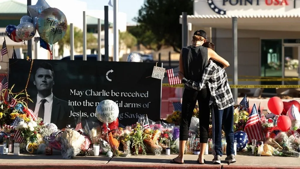 Arizonans mourn Turning Point USA Founder Charlie Kirk outside of the Turning Point USA headquarters on September 12, 2025 in Phoenix, Arizona. US President Donald Trump on Friday announced that the suspect had been taken into custody over the killing of right-wing activist Charlie Kirk after a massive manhunt. (Photo by CHARLY TRIBALLEAU / AFP)