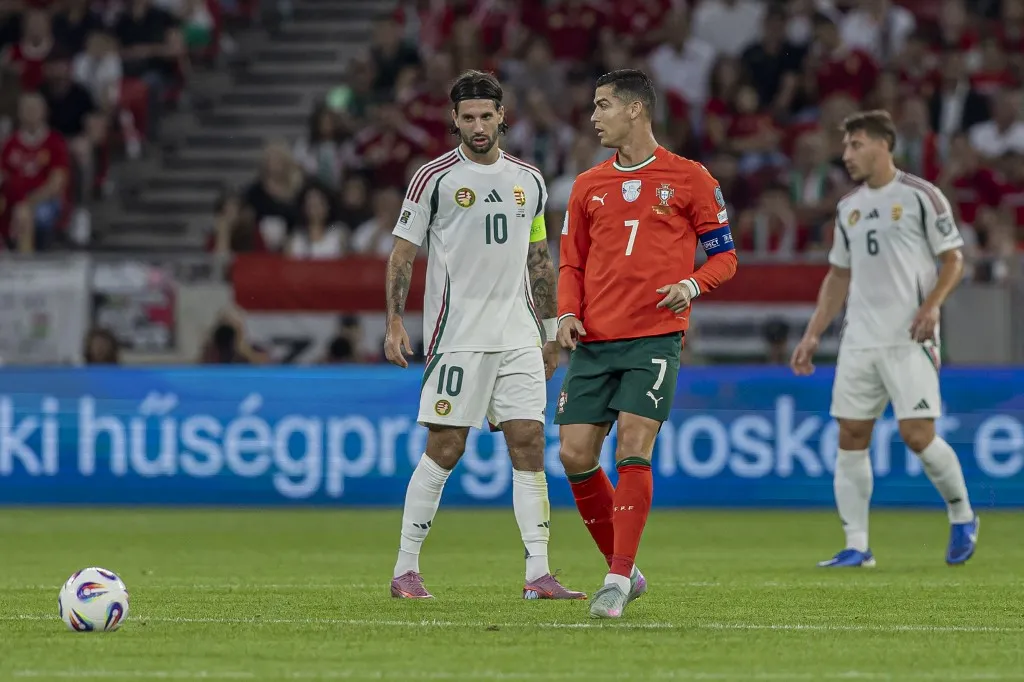 Dominik Szoboszlai of Hungary and Cristiano Ronaldo of Portugal participate in the FIFA 2026 World Cup Qualifiers match at Puskas Arena in Budapest, Hungary, on September 9, 2025. (Photo by Robert Szaniszlo/NurPhoto) (Photo by Robert Szaniszlo / NurPhoto via AFP)