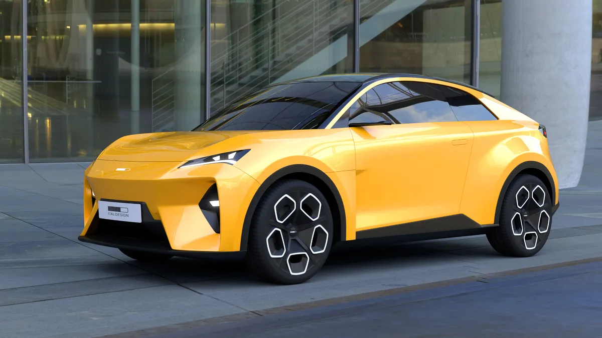 Volkswagen EVX áll egy üvegfal előtt.