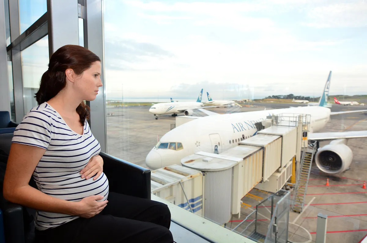 AUCKLAND - APR 10 2014:Pregnant passenger in Airport.Expectant Mothers, till the end of 35 weeks of pregnancy may be permitted to fly on Jet Airways flights provided there are no prior complications.