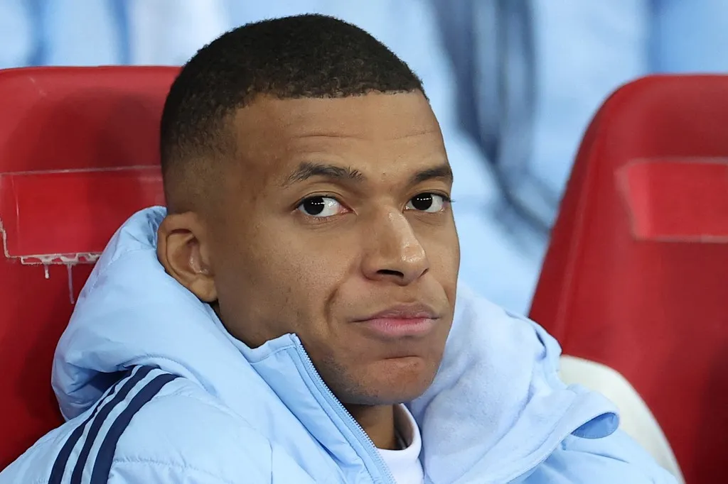 Real Madrid's French forward #09 Kylian Mbappe looks on from the bench during the UEFA Champions League football match between Lille LOSC and Real Madrid at the Pierre Mauroy Stadium in Villeneuve-d'Ascq, northern France, on October 2, 2024. Kylian Mbappe, linked by media to being the target of a rape investigation in Sweden, is to keep any explanations for Swedish justice, "if necessary", his lawyer said on October 17, 2024. (Photo by FRANCK FIFE / AFP)