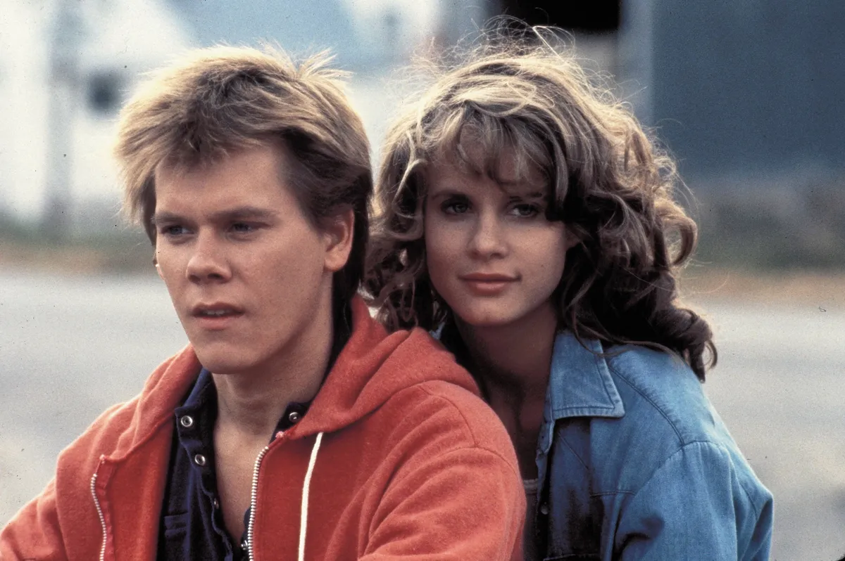 1984; Footloose. Original Film Title: Footloose, PICTURED: KEVIN BACON, LORI SINGER, Composer: Miles Goodman, Director: Herbert Ross, IN CAST: Kevin Bacon, Christopher Penn, John Lithgow, Sarah Jessica Parker, Dianne Wiest, Lori Singer Mandatory Credit: Photo by PARAMOUNT PICTURES/ZUMA Press. (©) Copyright 1984 by PARAMOUNT PICTURES.