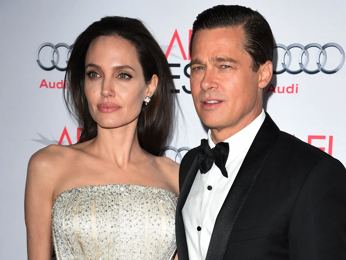 Writer-director-producer-actress Angelina Jolie Pitt (L) and actor-producer Brad Pitt arrive for the opening night gala premiere of Universal Pictures' 'By the Sea' during AFI FEST 2015 presented by Audi at the TCL Chinese Theatre in Hollywood, California on November 5, 2015.         AFP PHOTO / MARK RALSTON (Photo by MARK RALSTON / AFP)