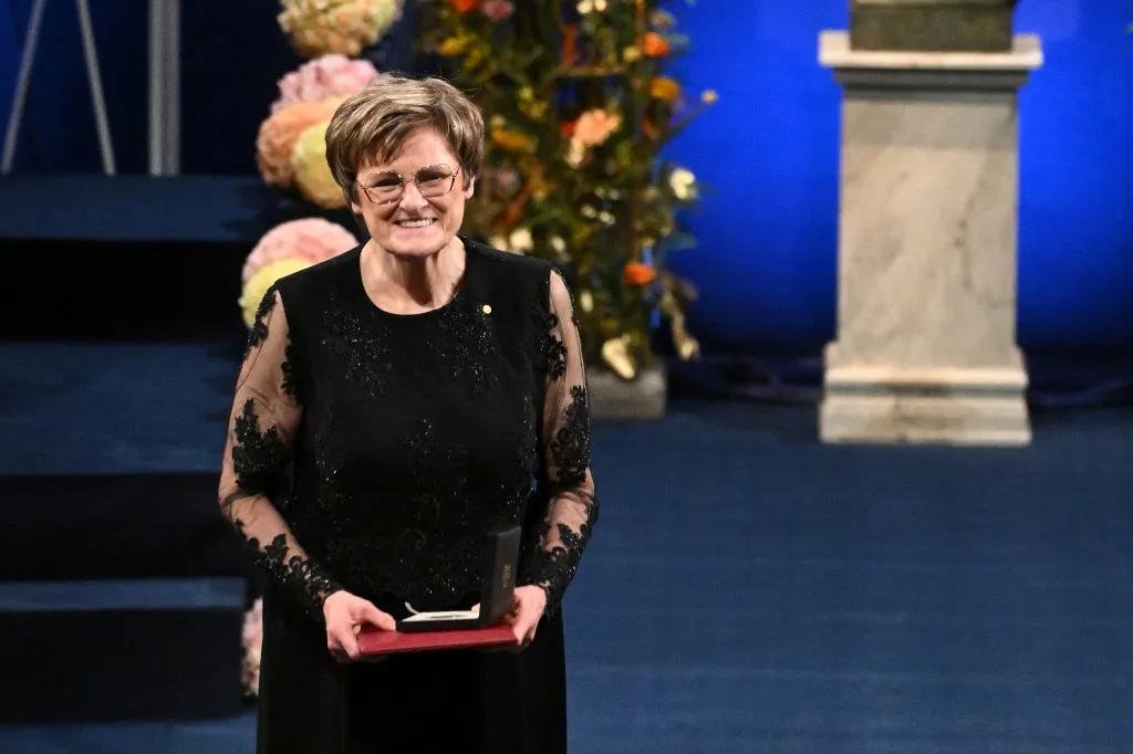 Laureate, Hungarian-US biochemist Katalin Kariko poses after having been awarded with the 2023 Nobel Prize in Physiology or Medicine during the Nobel awards ceremony at the Concert Hall in Stockholm, Sweden on December 10, 2023. (Photo by Jonathan NACKSTRAND / AFP)