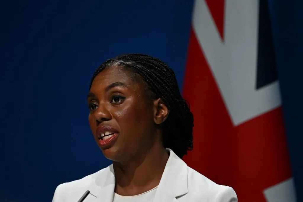 Britain's main opposition Conservative Party leader Kemi Badenoch delivers a welcome speech on the first day of the annual Conservative Party conference in Manchester, north-west England, on October 5, 2025.  (Photo by Paul ELLIS / AFP)