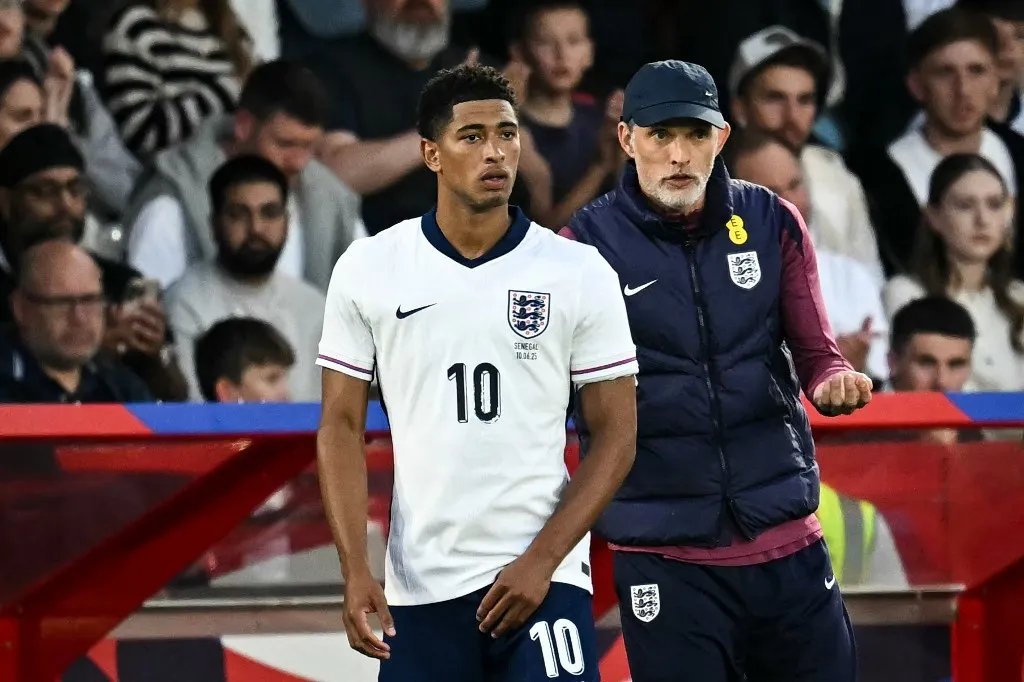 England's German head coach Thomas Tuchel (R) speaks to England's midfielder #10 Jude Bellingham as he prepates to enter the pitch during the international friendly football match between England and Senegal at the City Ground stadium, in Nottingham, on June 10, 2025. (Photo by Paul ELLIS / AFP) / NOT FOR MARKETING OR ADVERTISING USE / RESTRICTED TO EDITORIAL USE