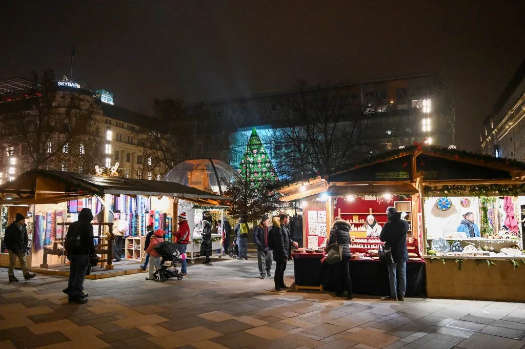Christmas decorations are pictured at a Christmas market in Vorosmarty square of Budapest downtown, Hungary, on December 19, 2023. (Photo by ATTILA KISBENEDEK / AFP)
