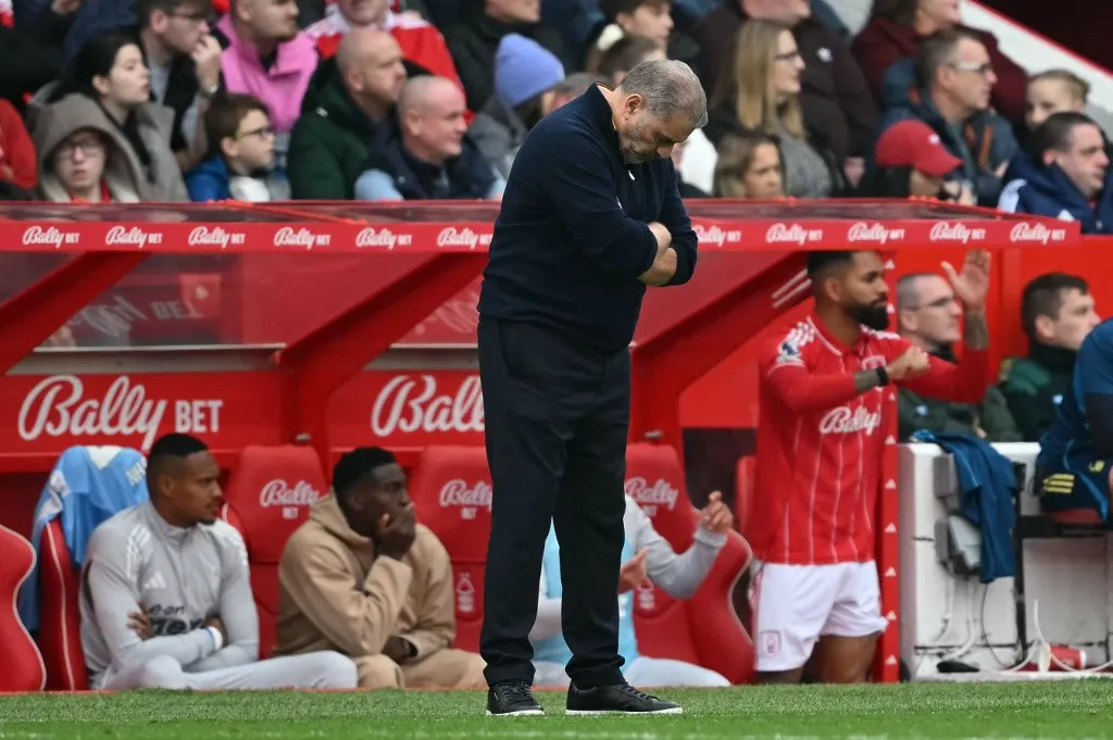 Nottingham Forest's Australian manager Ange Postecoglou reacts during the English Premier League football match between Nottingham Forest and Chelsea  at The City Ground in Nottingham, central England, on October 18, 2025. (Photo by JUSTIN TALLIS / AFP) / RESTRICTED TO EDITORIAL USE. No use with unauthorized audio, video, data, fixture lists, club/league logos or 'live' services. Online in-match use limited to 120 images. An additional 40 images may be used in extra time. No video emulation. Social media in-match use limited to 120 images. An additional 40 images may be used in extra time. No use in betting publications, games or single club/league/player publications. / 