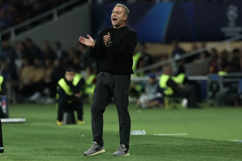 Barcelona's German coach Hans-Dieter Flick gestures during the UEFA Champions League league phase day 2 football match between FC Barcelona and Paris Saint-Germain (PSG) at the Estadi Olimpic Lluis Companys in Barcelona, on October 1, 2025. (Photo by Lluis GENE / AFP)